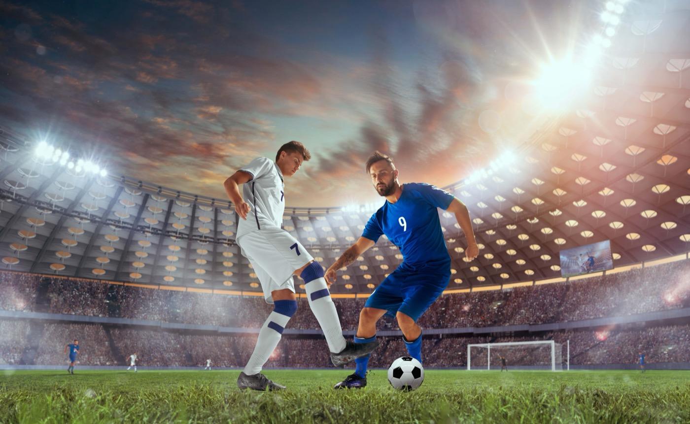 Soccer players competing in a professional stadium