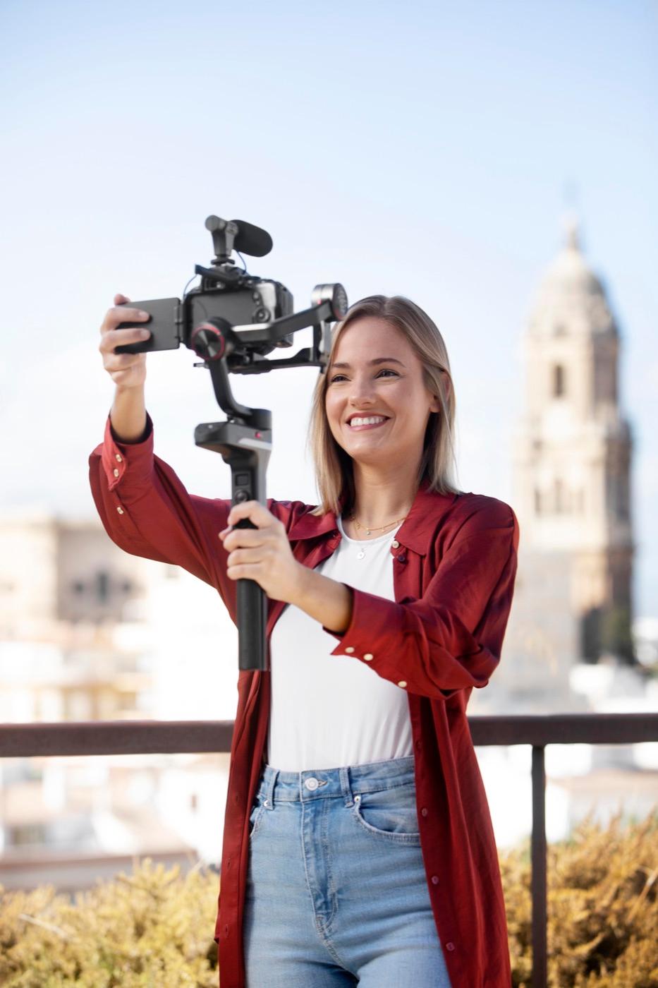 Creator filming video content on a gimbal